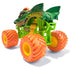 Rear angled view of Monster Jam Dragon diecast truck highlights neon green chassis, bold dragon body graphics, orange spiked horns, and oversized bright orange treaded wheels.