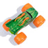 Top view of Monster Jam Dragon diecast truck shows sculpted green scaled body with raised fins, orange horns, dotted back detailing, and four large orange wheels positioned wide.