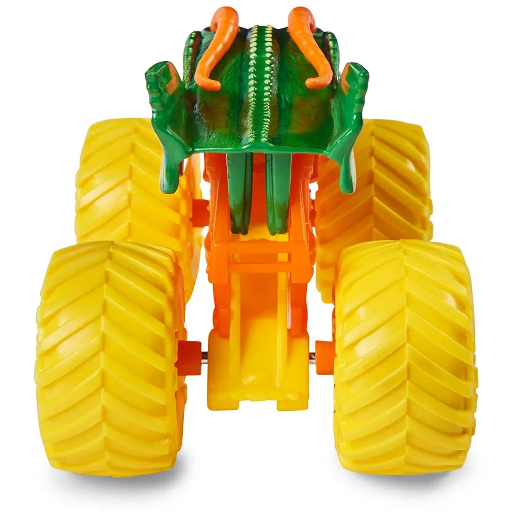 Monster Jam Dragon truck rear view in green and orange plastic with raised dragon spine details and thick yellow treaded wheels designed for toy racing shown on white background.