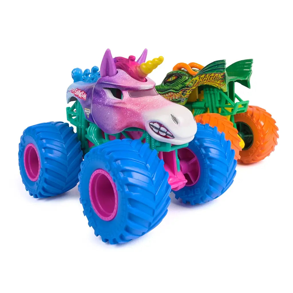 colorful monster truck toy Monster Jam Sparkle Smash, glossy plastic body in pink, purple, and blue with unicorn horn and sculpted face, oversized textured wheels, displayed on a clean white background