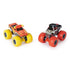Set of two Monster Jam toy trucks, El Toro Loco in red with yellow horns and Pirate’s Curse in black with a skull face, displayed side by side with bold colored tires.