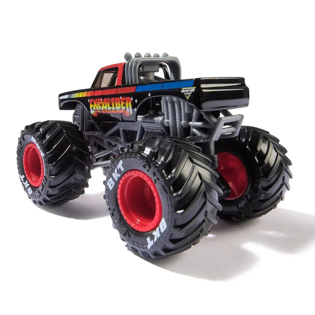 Rear angled view of Monster Jam Excaliber 1:64 diecast monster truck, showing rainbow side graphics, raised exhaust pipes, and oversized BKT black tires.