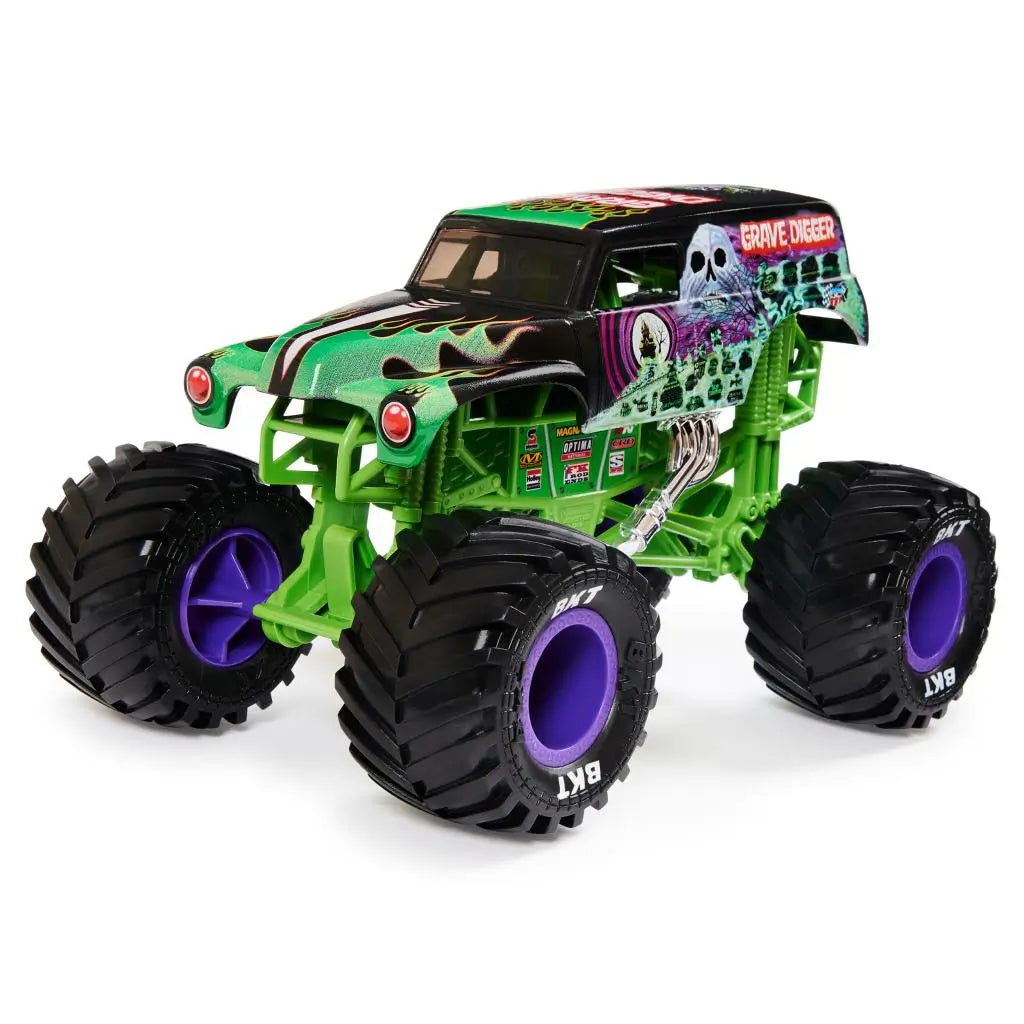 Angled view of the Monster Jam Grave Digger diecast truck highlights vivid green frame, spooky graveyard artwork, chrome exhaust pipes, and large black tires with purple hubs in a dynamic studio shot.
