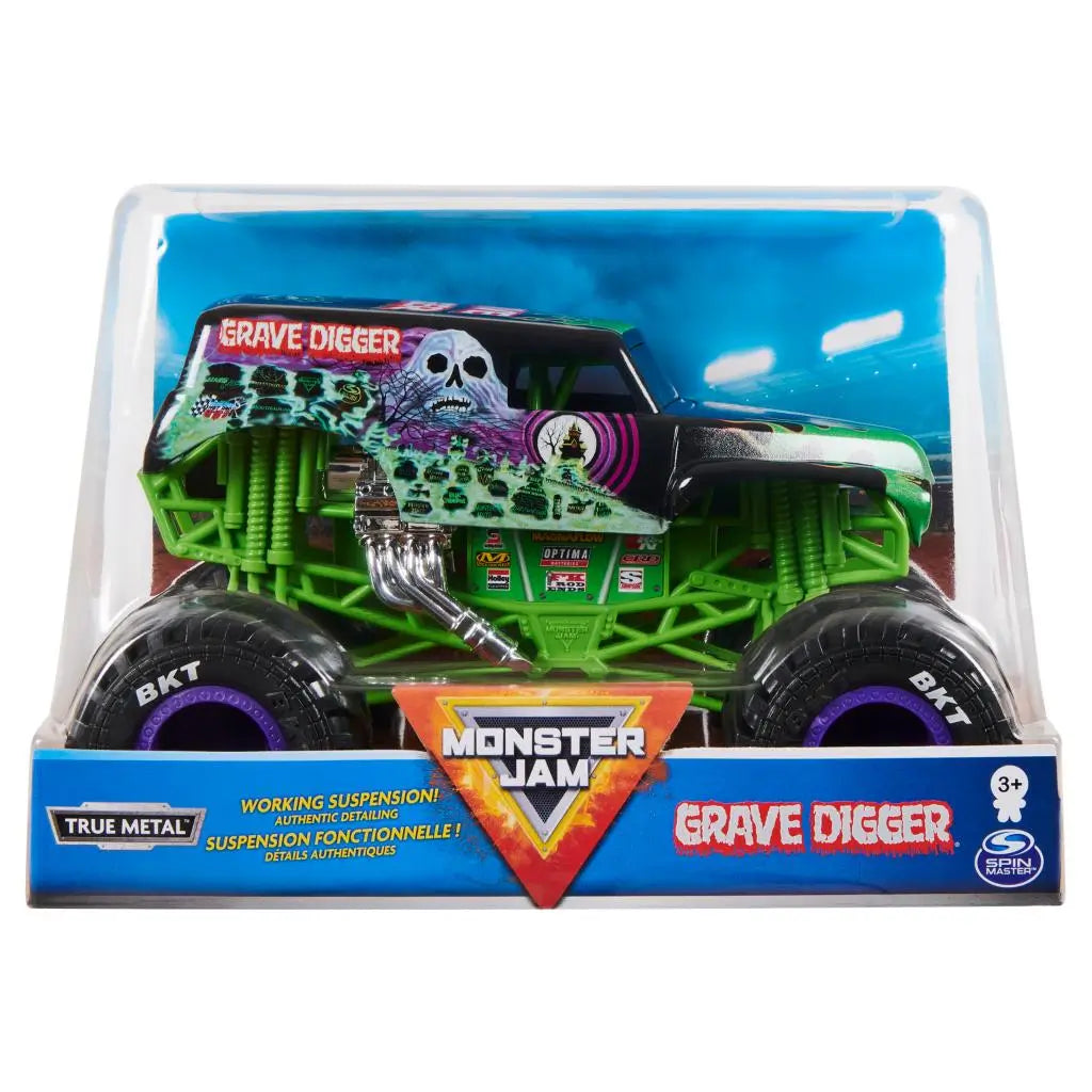 Monster Jam Grave Digger 1:24 scale diecast truck packaging displays the iconic green chassis, black haunted graphics, and large black BKT tires with purple accents inside a clear stadium-themed box.