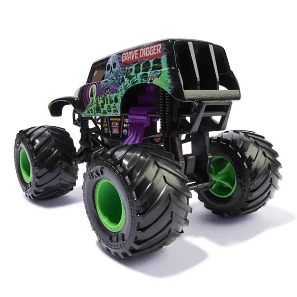 Rear angled view of Monster Jam Grave Digger 1:24 scale diecast truck, showing oversized black tires with green hubs, purple exhaust pipes, and ghostly artwork.
