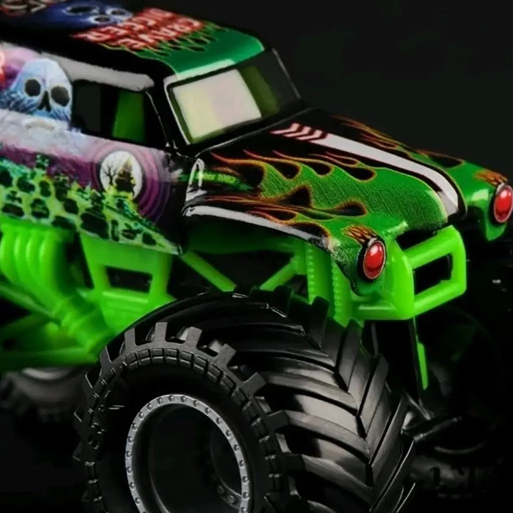Monster Jam Grave Digger 1:64 scale diecast truck in green and black with flame decals, red headlights, and ghostly skull graphics, shown close-up highlighting tire details.