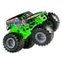 Diecast Monster Jam Grave Digger truck at side angle, showing bright green chassis, oversized black tread tires, and detailed ghost and skull artwork along the body.