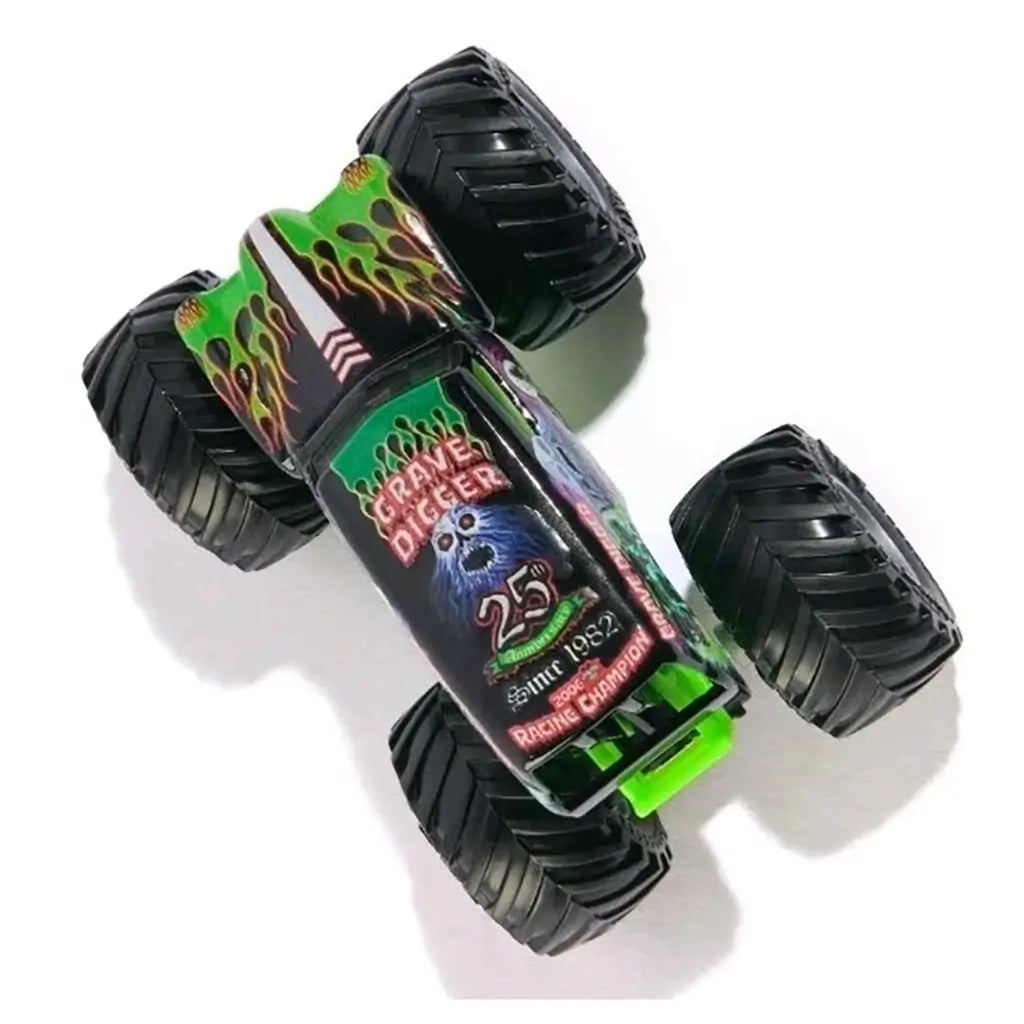 Top view of Monster Jam Grave Digger 1:64 diecast monster truck, featuring green flame graphics, bold “Grave Digger” logo, and 25th anniversary commemorative design.