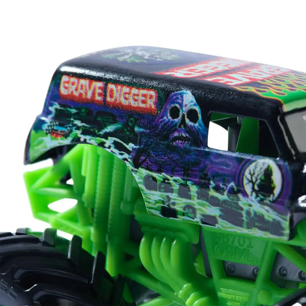 Monster Jam Grave Digger Legacy 1:64 scale toy truck close-up highlighting roof and side artwork with red Grave Digger text, skull design, haunted trees, and purple mist.