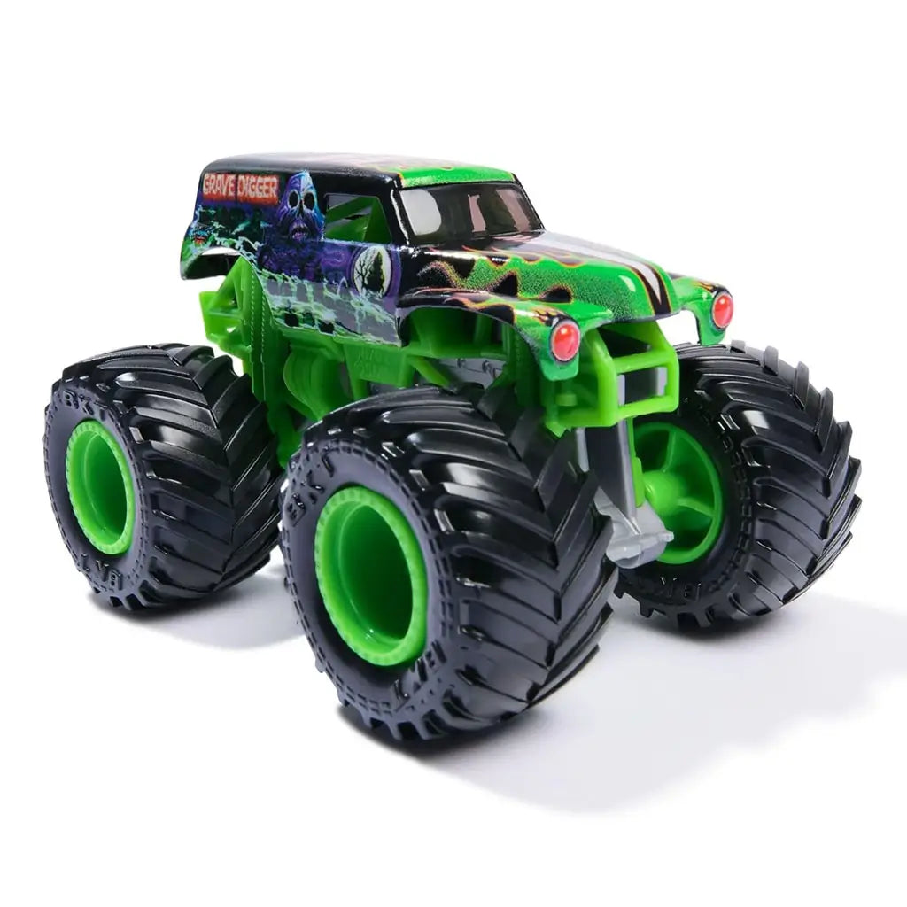 Monster Jam Grave Digger Legacy 1:64 scale toy monster truck front angled view featuring green frame, headlights, skeletal graphics, and giant black tires with green rims.