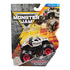 Monster Jam toy truck packaging in gray, yellow, and black cardboard with plastic blister casing, featuring Monster Mutt Dalmatian die-cast truck, displayed against a rugged graphic background.