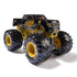 Angled view of Monster Jam Kane Brown K-Rex diecast truck at 1:64 scale, with sleek black cab, orange accents, gold undercarriage, and massive BKT tires.