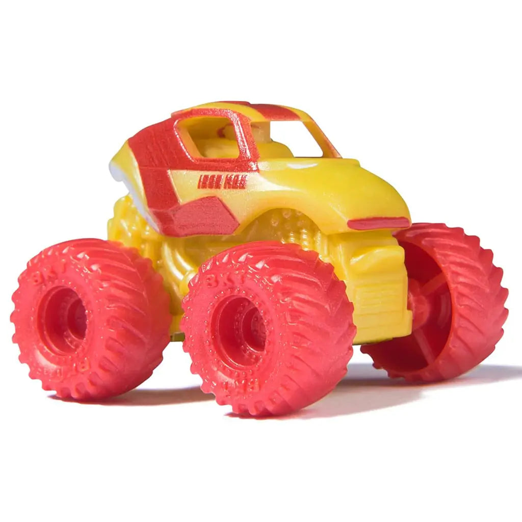 Marvel Iron Man mini Monster Jam truck in 1:87 scale, bright red and yellow with red wheels, angled view highlighting superhero armor-inspired design and compact monster truck form.