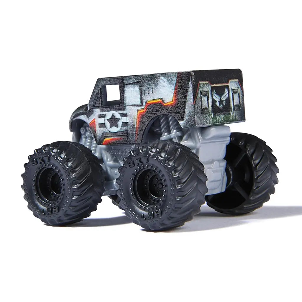 Rear angled view of Monster Jam Marvel Thor mini monster truck featuring gray armor-like design, red hammer accent, and large rugged black tires.