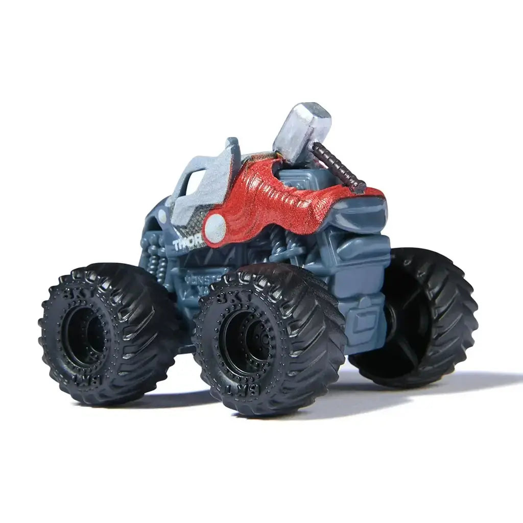 Marvel Thor mini Monster Jam truck in 1:87 scale, gray with silver hammer on top, red cape accents, and black wheels, rear angled view highlighting Norse superhero design.