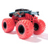 Marvel Monster Jam Venom toy truck rear view displays menacing jaw graphics, glossy black body shell, lifted red chassis, and massive rugged red wheels angled backward.