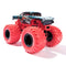 Front angled shot of Monster Jam Marvel Venom truck shows chrome-detailed grille, sharp fang artwork, and oversized textured red tires on a bold lifted chassis design.