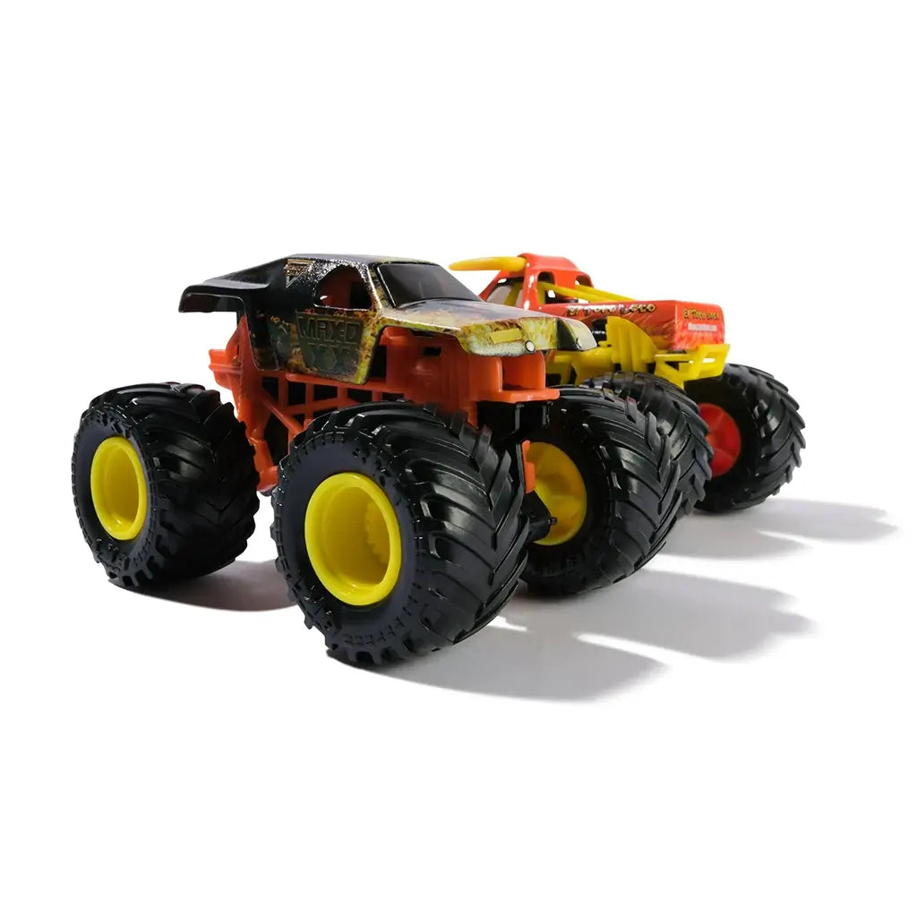 Monster Jam Max D XX truck in black and orange distressed style plastic with flame graphics and oversized yellow wheel rims designed for racing play displayed in a minimal studio background.