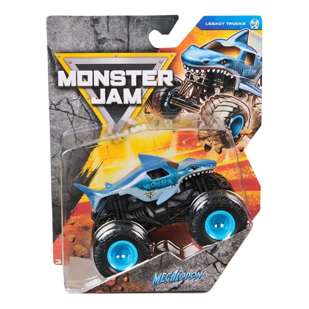 Monster Jam Megalodon toy truck in metallic blue shark design with bold graphics, sealed in a clear blister package against a fiery yellow arena backdrop emphasizing its legacy-truck theme.