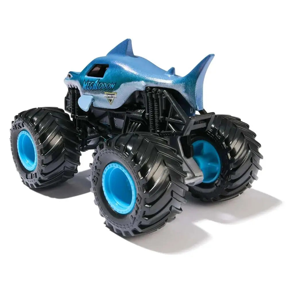 Metallic blue Monster Jam Megalodon toy truck featuring a sculpted shark body, oversized black treaded tires with blue centers, shown from a rear angle on a plain white studio background.