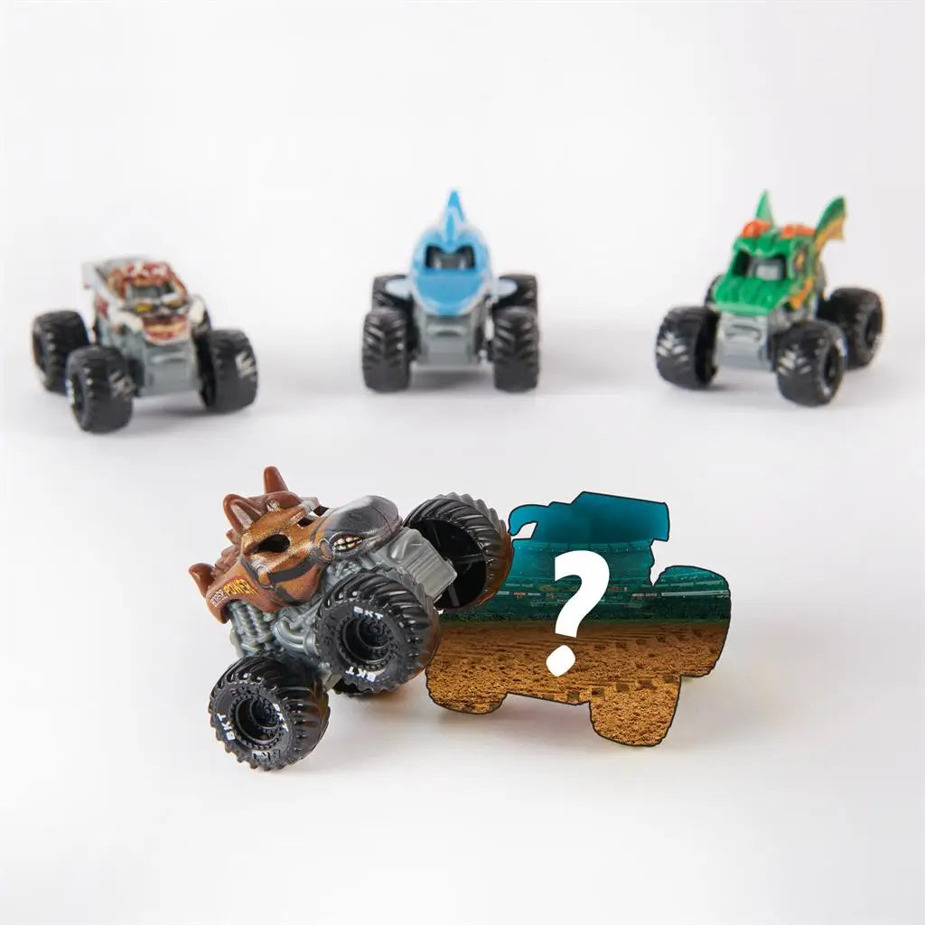 Monster Jam Mini collectible surprise truck display featuring several revealed 1:87 scale trucks and a mystery silhouette piece, emphasizing blind-pack style collecting and varied monster truck character designs.