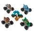 Monster Jam Mini 1:87 monster trucks shown from a top and angled layout around a mystery silhouette, highlighting assorted character designs, chunky black tires, and compact die-cast style forms on a clean white background.