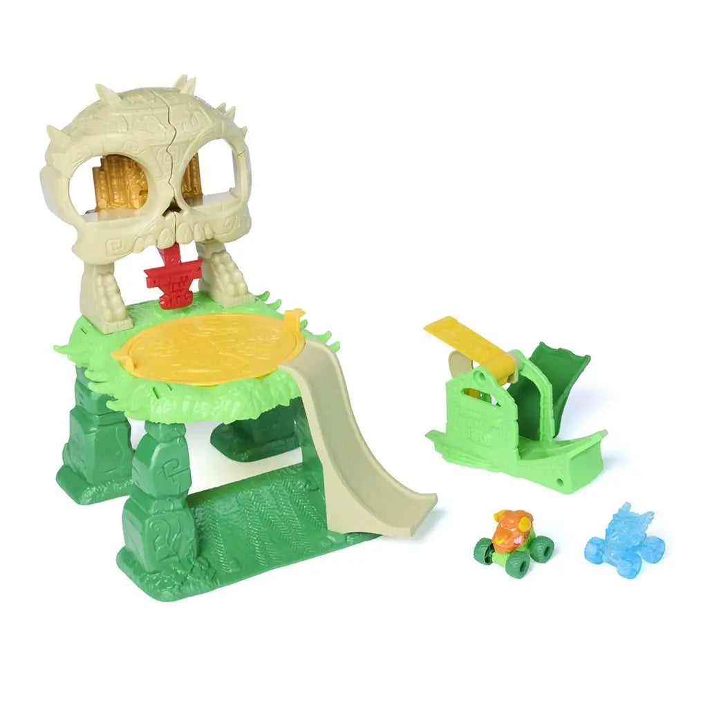 Monster Jam Mini Jams Crash ’n Crumble Jungle playset assembled with tan skull structure, green jungle base, yellow trap platform, curved slide ramp, and mini monster trucks, designed for repeat smash and stunt action.