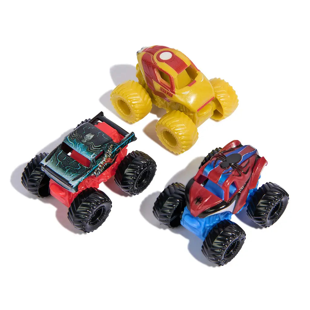 Monster Jam Mini Jams Marvel trucks in red, yellow, and blue plastic and metal finishes, compact monster truck shapes with oversized wheels for stunt play, grouped together on a clean white background