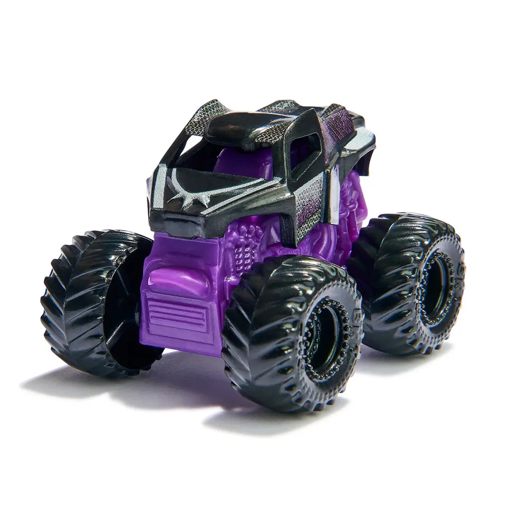 Monster Jam Black Panther mini truck in black and purple plastic with metallic accents, oversized black textured wheels, compact monster truck toy design for play, displayed on a simple white studio background.