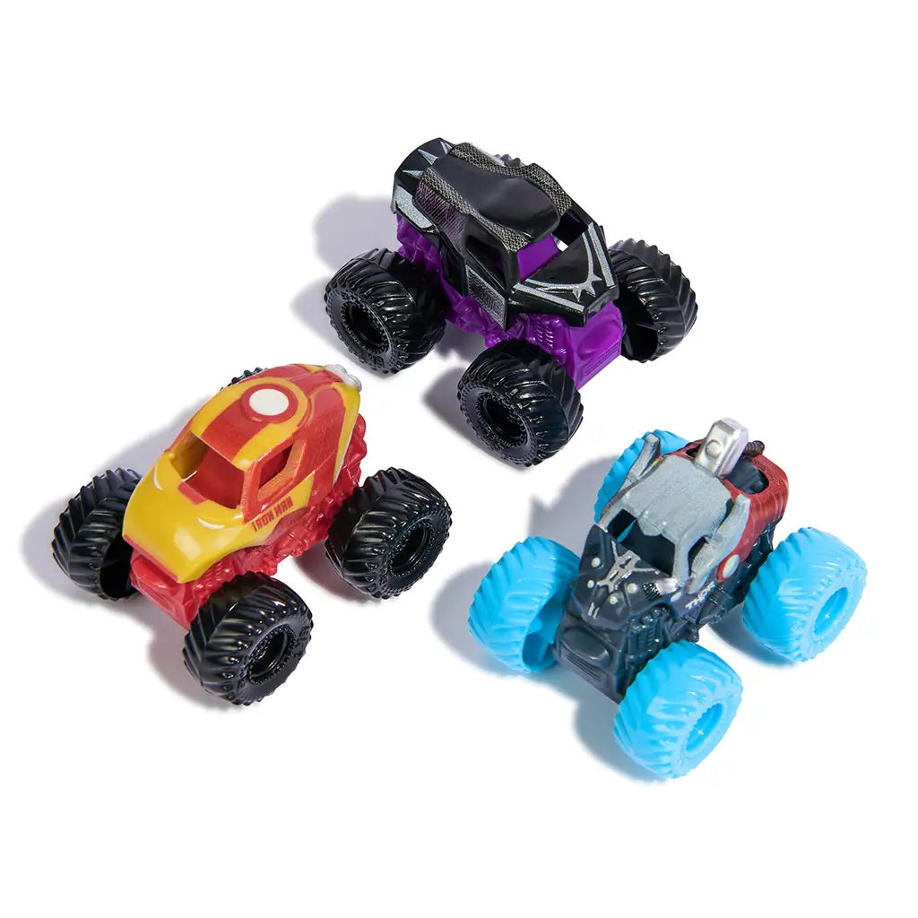 Monster Jam Mini Jams Marvel three pack trucks in mixed colors and plastic textures with oversized rugged wheels, compact monster truck toy shapes themed after superheroes, arranged on a clean white surface.