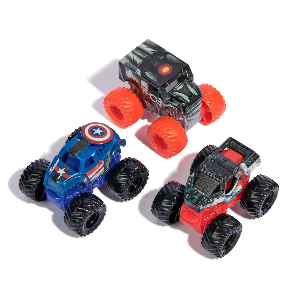 Monster Jam Mini Jams Marvel mini trucks in red, blue, and black plastic with textured oversized wheels, compact toy vehicle forms themed after superheroes, arranged on a bright white studio surface.
