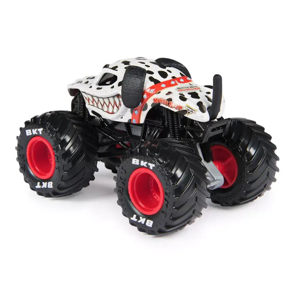 Monster Jam Monster Mutt Dalmatian truck in white painted metal with black spotted texture and sculpted dog features, large rubber tires with red rims, shown at a rear angled view on white background.