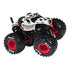 Monster Jam Monster Mutt Dalmatian toy truck in white and black spotted metal body with textured dog face design, oversized rubber tires and red wheel rims, isolated on a white background.