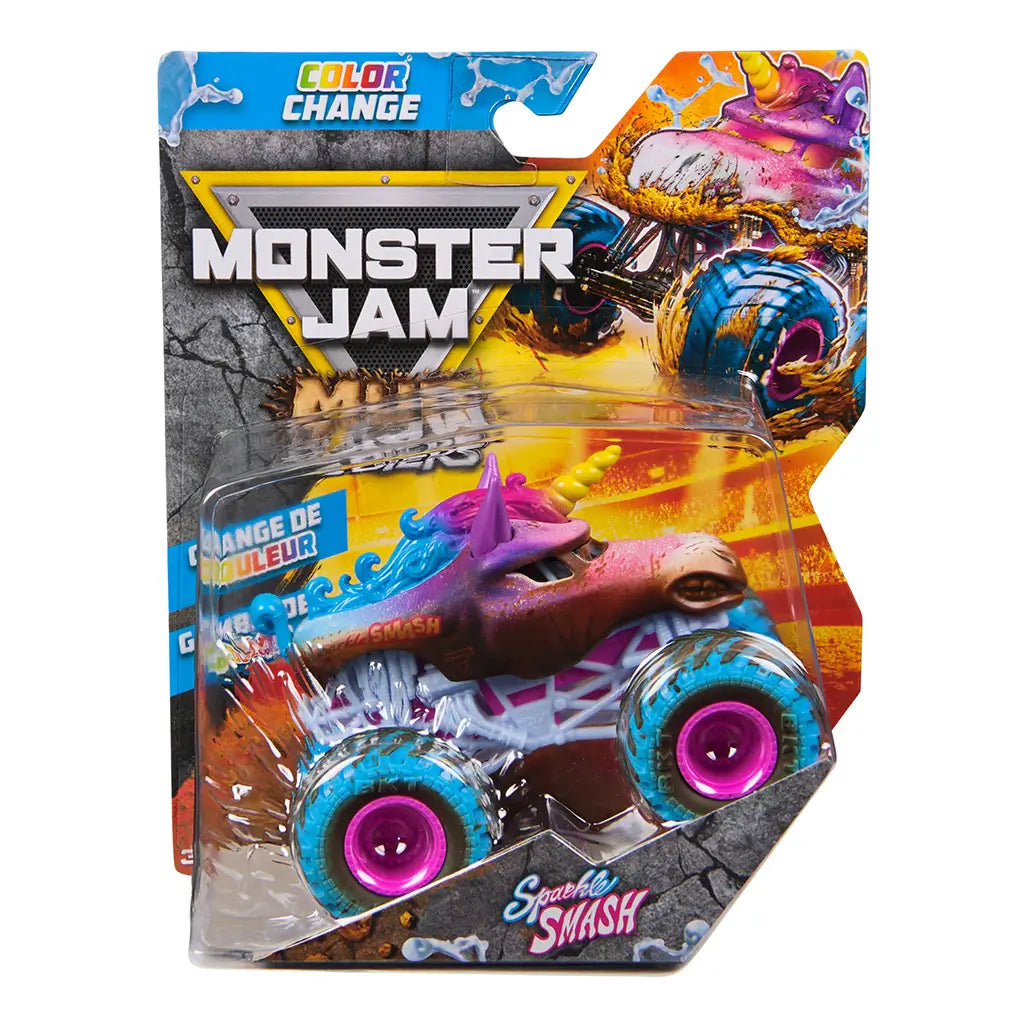 Monster Jam Sparkle Smash color change toy truck in pink, blue, and brown plastic with mud detailing, teal tires and pink rims, unicorn-themed monster truck form, packaged in bold retail box with logo and action graphics