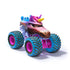 Monster Jam Sparkle Smash toy truck in pink and blue plastic with mud detailing, oversized teal tires and pink rims, unicorn-themed monster truck shape for play, angled front view isolated on a clean white background