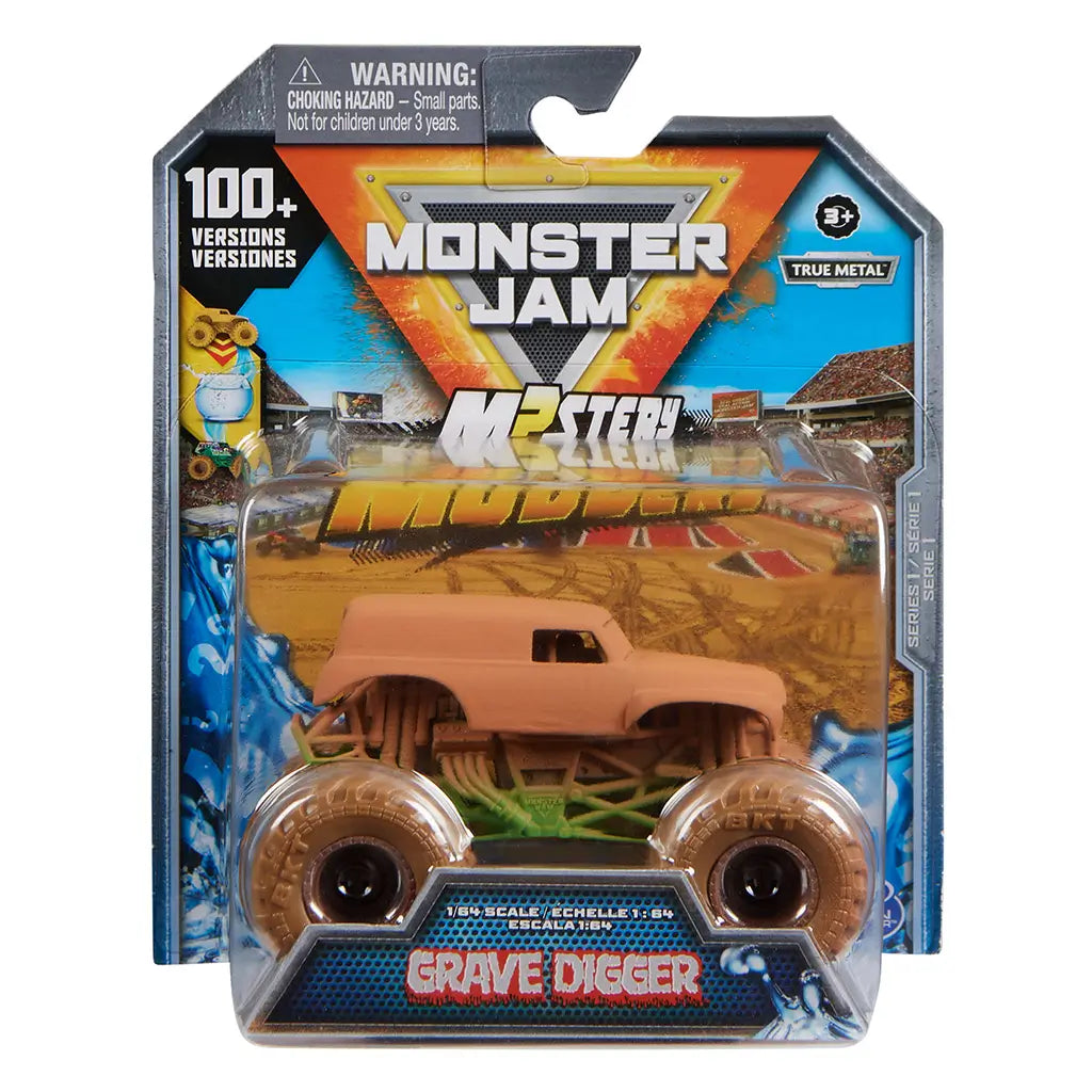 Monster Jam Mystery Mudders Earth Shaker toy truck in brown plastic with muddy texture and oversized wheels, packaged in retail blister card with branding and graphics on a store display background.