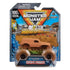 Monster Jam Mystery Mudders toy truck in brown mud-covered plastic body with oversized rubber tires, enclosed in retail blister packaging, presented against branded cardboard backing with bold product graphics.