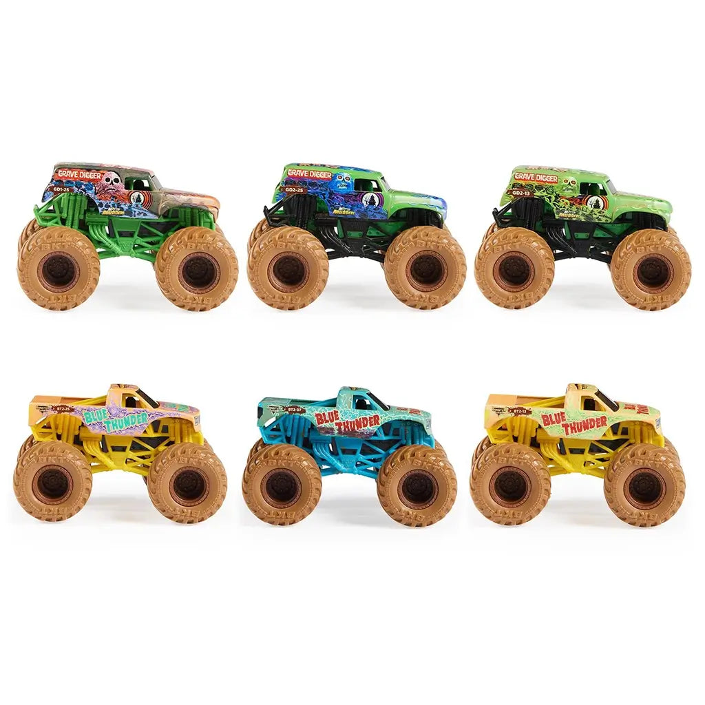 Monster Jam toy trucks in green, blue, and yellow with plastic bodies, oversized rubber tires, and elongated shapes, shown in side profile to highlight detailed graphics and collectible styling on white background.
