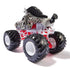 Rear angled view of Monster Jam Racing Stripes diecast monster truck, showing zebra-patterned body, red undercarriage, white frame, and large tread tires.