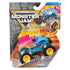 Monster Jam Ringling Bailey Circuit toy truck in blue and pink plastic with bold graphics, enclosed in clear blister packaging against rugged cracked-rock backdrop highlighting arena action theme.