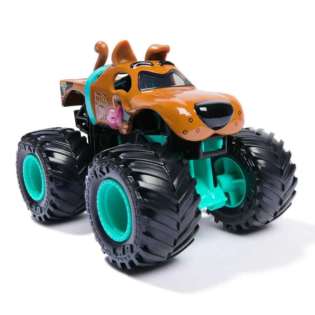 Monster Jam Scooby-Doo toy truck front view with sculpted snout, dog ears, tongue detail, teal chassis, oversized treaded tires, and teal hubs styled for fans and collectible display.