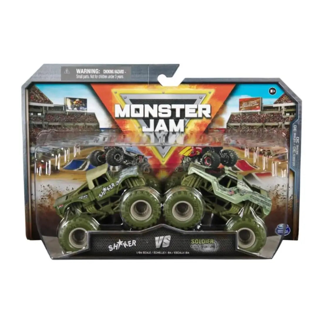 Monster Jam Shaker vs Soldier Fortune 1:64 scale 2-pack toy trucks in retail packaging, featuring colorful stadium graphics, Monster Jam branding, and dual truck display window.