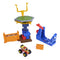 Monster Jam playset with bright yellow, blue, and orange molded plastic parts, stacked tower platform, launcher ramp, and accessories, designed as a classroom-themed smash course for monster truck stunt play.
