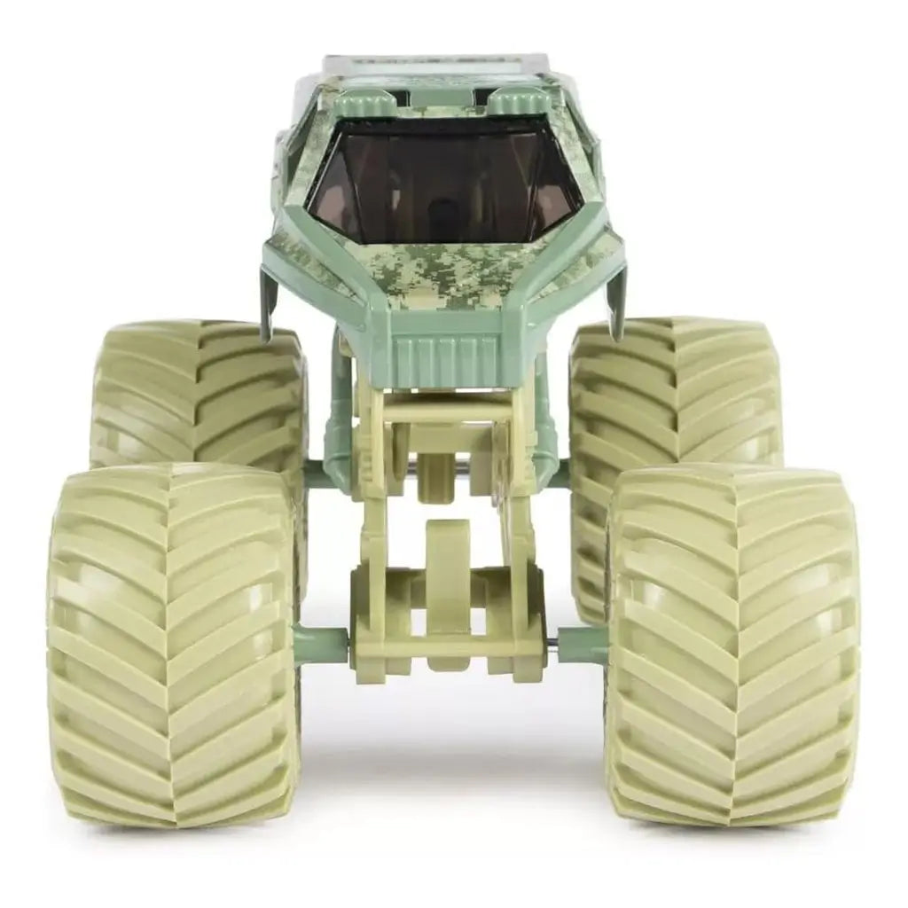 Front view of Monster Jam Soldier Fortune diecast truck features angular armored-style cab, tan camouflage pattern, tinted windows, and oversized beige tires dominating the stance.