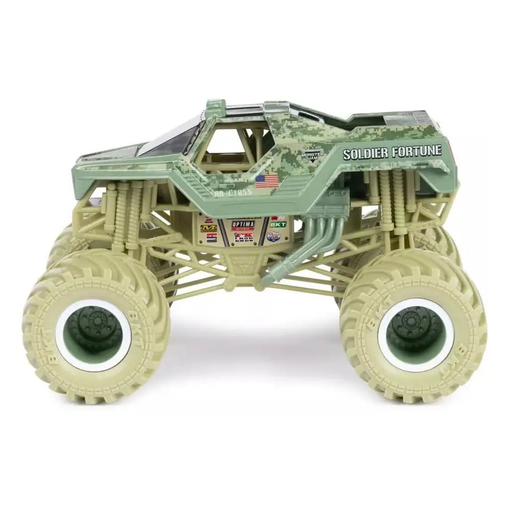 Side view of Monster Jam Soldier Fortune 1:24 scale diecast truck shows military-inspired green camo body, Soldier Fortune branding, U.S. flag detail, and oversized beige tires.