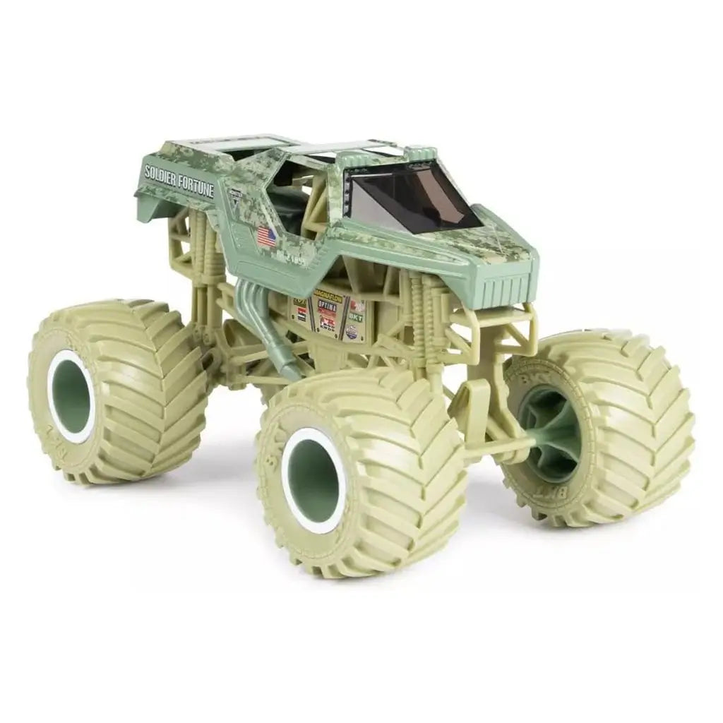 Angled view of Monster Jam Soldier Fortune diecast truck highlights desert camo paint, black tinted cab, rugged suspension, and giant beige wheels with deep tread for off-road play.