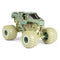 Angled view of Monster Jam Soldier Fortune diecast truck highlights desert camo paint, black tinted cab, rugged suspension, and giant beige wheels with deep tread for off-road play.