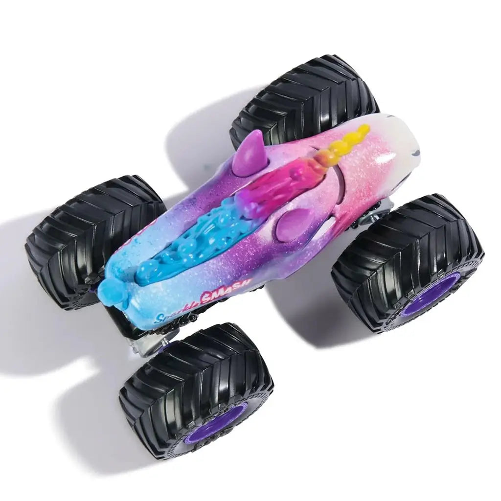 Monster Jam Sparkle Smash Legacy 1:64 scale toy truck top view highlighting unicorn horn, blue mane, sparkling gradient colors, and giant black tires with purple rims.