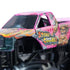 Closeup of Monster Jam Stone Crusher toy truck in pink with fiery yellow-orange graphics, bold 'Stone Crusher' logo, rugged details, and oversized black tires for dramatic off-road style.