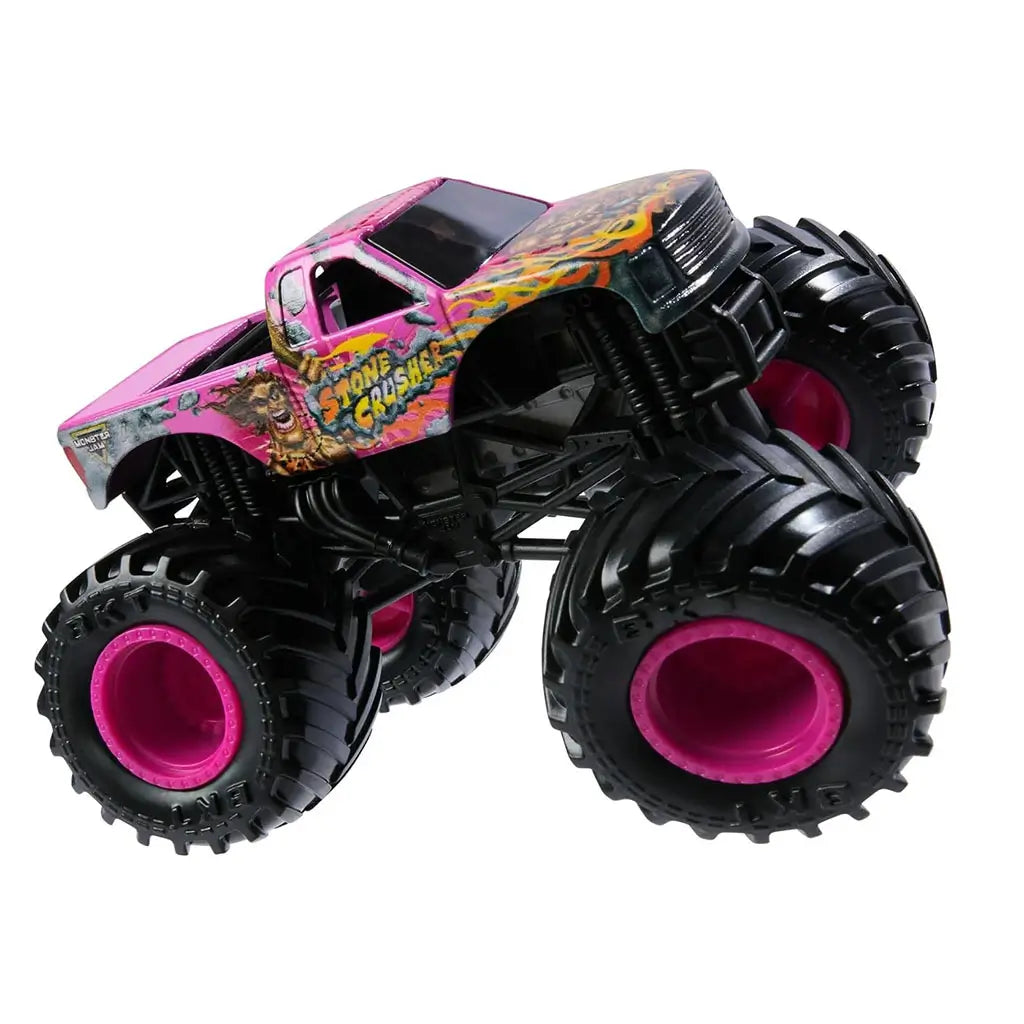 Side view of Monster Jam Stone Crusher monster truck toy with pink body, black rugged tires, pink wheel hubs, and colorful flame graphics as part of the Monster Jam Danger Divas lineup.